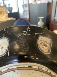 A Japanese-lacquered Chinese blue and white dish and a Japanese Kutani 'phoenix' dish, Wanli/19th C.