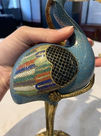 A pair of Chinese cloisonn&eacute; cranes, later mounted as candelabras, 18th C.