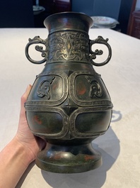 A Chinese archaistic gold- and silver-inlaid bronze vase with pseudo-rust patina, 19th C.