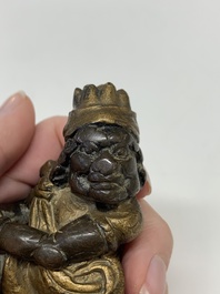 A small Chinese gilt bronze paperweight in the form of a kneeling foreigner, Ming