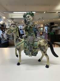 A fine Chinese verte biscuit sculpture of a Heavenly King on horseback, 19th C.