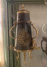 A rare and fine Chinese partly-gilt copper chocolate pot with tripod stand, 18th C.