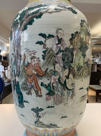 A large Chinese famille rose coral-red-ground  'Eight Immortals' vase, Qianlong mark, 19th C.