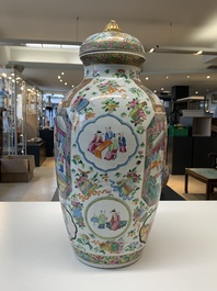 A pair of Chinese Canton famille rose vases and covers with narrative design, 19th C.