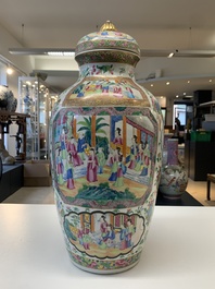 A pair of Chinese Canton famille rose vases and covers with narrative design, 19th C.