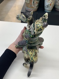 A fine Chinese verte biscuit sculpture of a Heavenly King on horseback, 19th C.