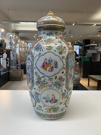 A pair of Chinese Canton famille rose vases and covers with narrative design, 19th C.