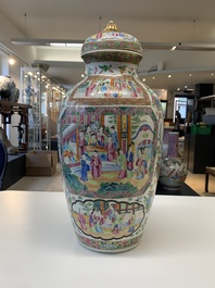 A pair of Chinese Canton famille rose vases and covers with narrative design, 19th C.