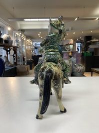 A fine Chinese verte biscuit sculpture of a Heavenly King on horseback, 19th C.