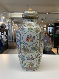 A pair of Chinese Canton famille rose vases and covers with narrative design, 19th C.