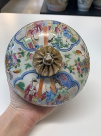 A pair of Chinese Canton famille rose vases and covers with narrative design, 19th C.