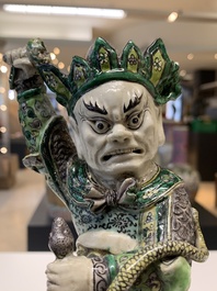 A fine Chinese verte biscuit sculpture of a Heavenly King on horseback, 19th C.