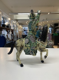 A fine Chinese verte biscuit sculpture of a Heavenly King on horseback, 19th C.