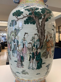 A large Chinese famille rose coral-red-ground  'Eight Immortals' vase, Qianlong mark, 19th C.