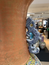 A large Chinese famille rose coral-red-ground  'Eight Immortals' vase, Qianlong mark, 19th C.