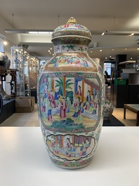 A pair of Chinese Canton famille rose vases and covers with narrative design, 19th C.