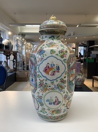A pair of Chinese Canton famille rose vases and covers with narrative design, 19th C.