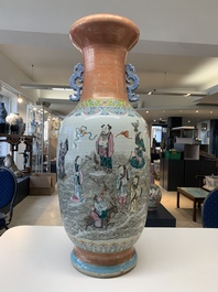 A large Chinese famille rose coral-red-ground  'Eight Immortals' vase, Qianlong mark, 19th C.