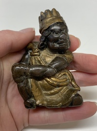 A small Chinese gilt bronze paperweight in the form of a kneeling foreigner, Ming