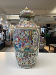 A pair of Chinese Canton famille rose vases and covers with narrative design, 19th C.