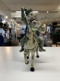 A fine Chinese verte biscuit sculpture of a Heavenly King on horseback, 19th C.