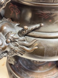 A massive Vietnamese copper- and silver-inlaid 'Buddhist lion' censer and cover on stand, 19th C.