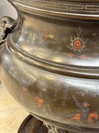 A massive Vietnamese copper- and silver-inlaid 'Buddhist lion' censer and cover on stand, 19th C.
