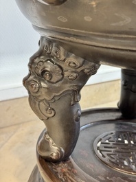 A massive Vietnamese copper- and silver-inlaid 'Buddhist lion' censer and cover on stand, 19th C.