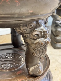 A massive Vietnamese copper- and silver-inlaid 'Buddhist lion' censer and cover on stand, 19th C.