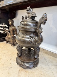 A massive Vietnamese copper- and silver-inlaid 'Buddhist lion' censer and cover on stand, 19th C.