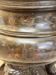 A massive Vietnamese copper- and silver-inlaid 'Buddhist lion' censer and cover on stand, 19th C.