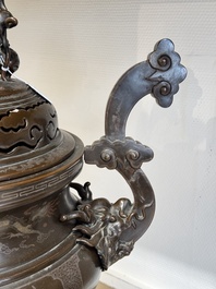 A massive Vietnamese copper- and silver-inlaid 'Buddhist lion' censer and cover on stand, 19th C.