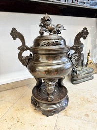 A massive Vietnamese copper- and silver-inlaid 'Buddhist lion' censer and cover on stand, 19th C.