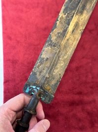 A rare Chinese turquoise-inlaid parcel-gilt bronze sword, Zhou
