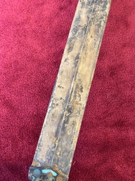 A rare Chinese turquoise-inlaid parcel-gilt bronze sword, Zhou