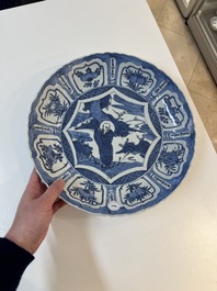 A Chinese blue and white 'kraak' dish with Damo in a landscape, Wanli