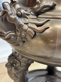 A massive Vietnamese copper- and silver-inlaid 'Buddhist lion' censer and cover on stand, 19th C.