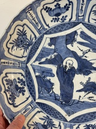 A Chinese blue and white 'kraak' dish with Damo in a landscape, Wanli