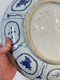 A Chinese blue and white 'kraak' dish with Damo in a landscape, Wanli