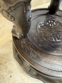 A massive Vietnamese copper- and silver-inlaid 'Buddhist lion' censer and cover on stand, 19th C.