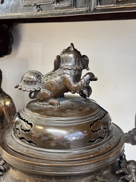 A massive Vietnamese copper- and silver-inlaid 'Buddhist lion' censer and cover on stand, 19th C.