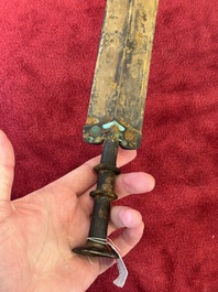 A rare Chinese turquoise-inlaid parcel-gilt bronze sword, Zhou