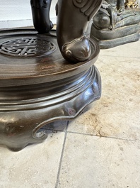 A massive Vietnamese copper- and silver-inlaid 'Buddhist lion' censer and cover on stand, 19th C.