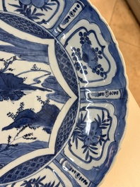 A Chinese blue and white 'kraak' dish with Damo in a landscape, Wanli
