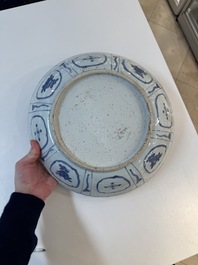 A Chinese blue and white 'kraak' dish with Damo in a landscape, Wanli