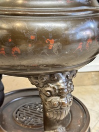 A massive Vietnamese copper- and silver-inlaid 'Buddhist lion' censer and cover on stand, 19th C.