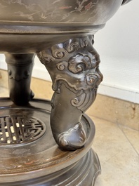 A massive Vietnamese copper- and silver-inlaid 'Buddhist lion' censer and cover on stand, 19th C.