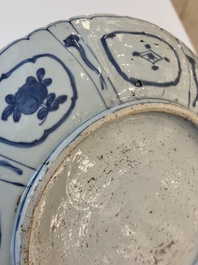 A Chinese blue and white 'kraak' dish with Damo in a landscape, Wanli