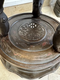A massive Vietnamese copper- and silver-inlaid 'Buddhist lion' censer and cover on stand, 19th C.