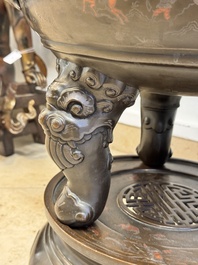 A massive Vietnamese copper- and silver-inlaid 'Buddhist lion' censer and cover on stand, 19th C.
